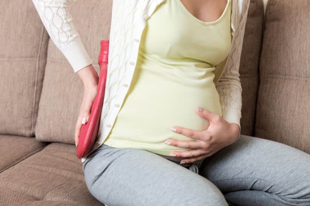 Värmeflaskan kan hjälpa lindra smärtan under graviditeten